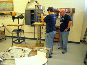 Drilling light hole in outside cylinder.